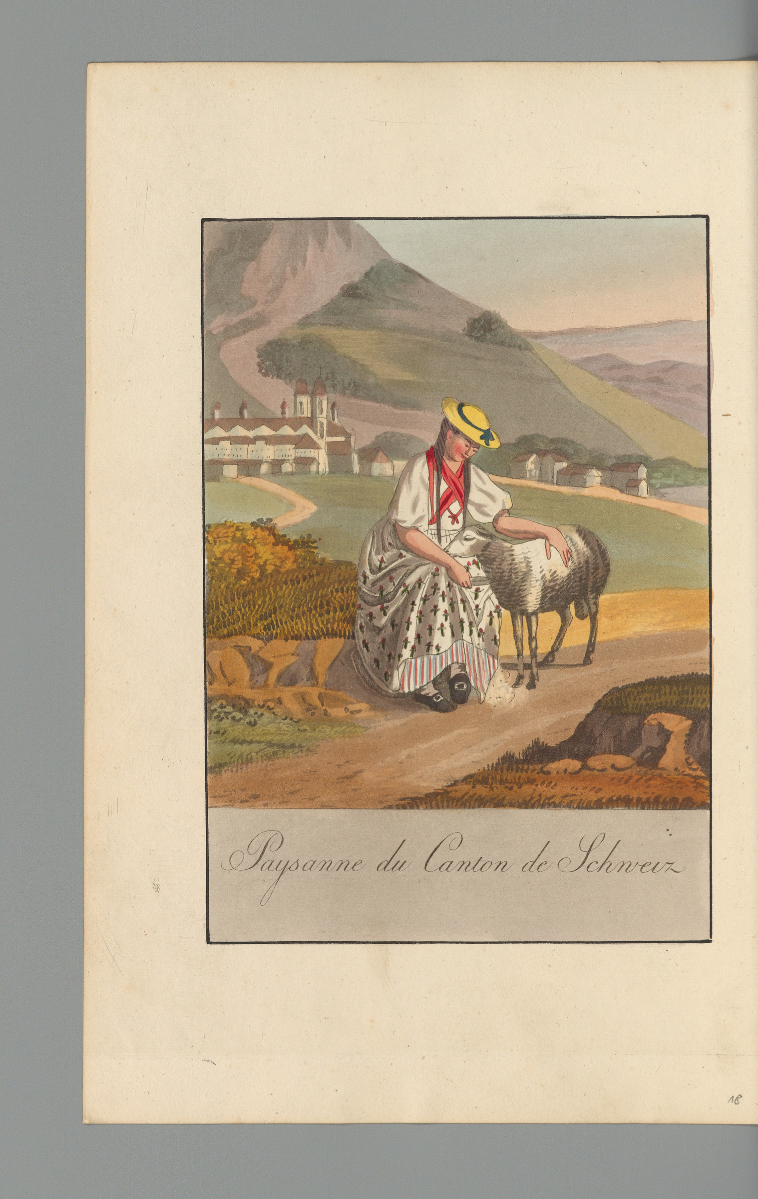Figura intera femminile in costume tradizionale del Cantone di Svitto, seduta mentre accarezza una pecora, inserita in un paesaggio con l’Abbazia di Einsiedeln sullo sfondo